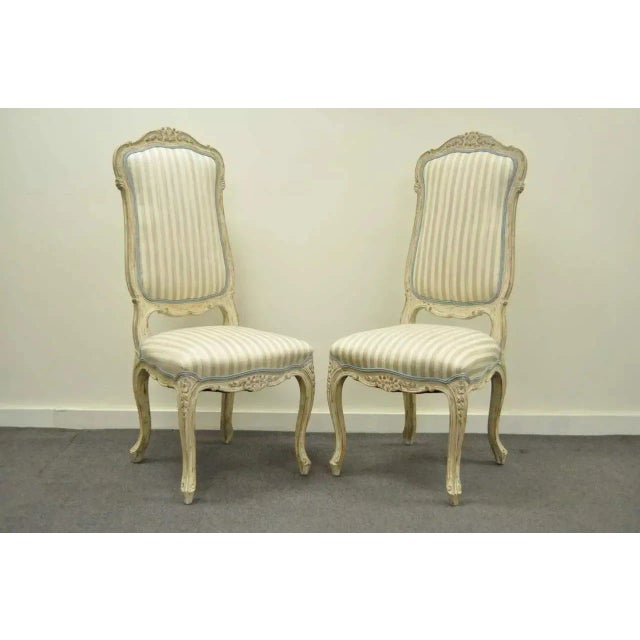 Great set of 4 vintage distress painted dining chairs in the Swedish Rococo / French Louis XV Style. Chairs feature...