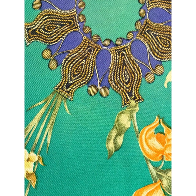 HERMES ARABESQUES 1964 silk scarf This lovely green scarf features delicate flowers of various varieties, accompanied by...