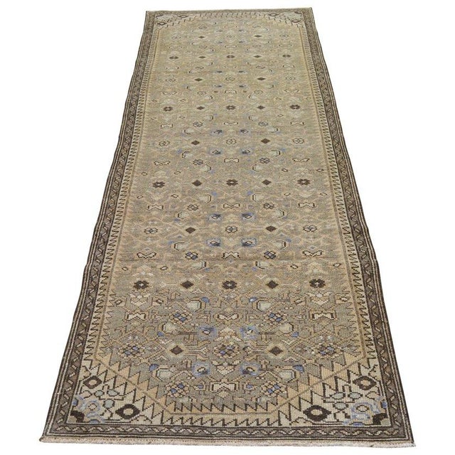 Hand-knotted with care using traditional rug-making techniques, this wool rug blends timeless craftsmanship with a modern...