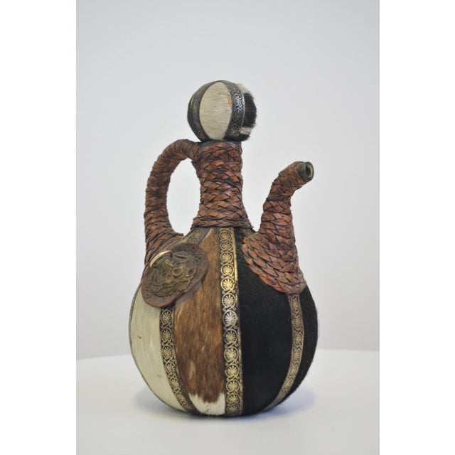 Glass pitcher covered in leather cord and cow hair, embroidered, 1950s