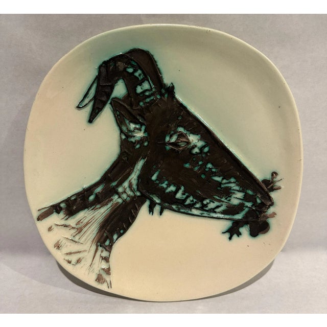 This Picasso ceramic plate "Tête de chèvre de profil' Ramié 110 is one in a small edition of only 60 and is glazed and...