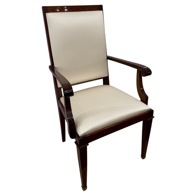 An Art Deco period arm chair from France circa 1930. Mahogany with patinated bronze sabots.