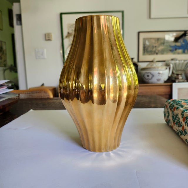 The Jonathan Adler Gold Belly Ribbed Pottery Vase is a vintage piece from the late 20th century, showcasing a mid-century...