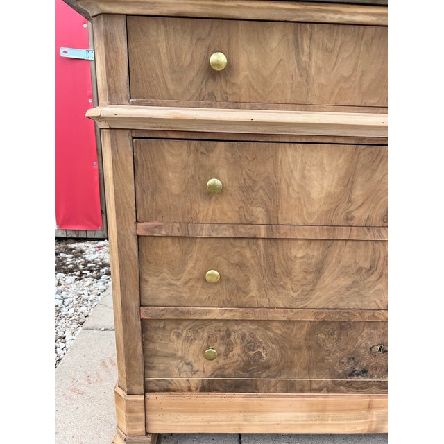 Elegant French 19th-century Louis Philippe solid walnut commode, dating to approximately 1840–1860, featuring four...