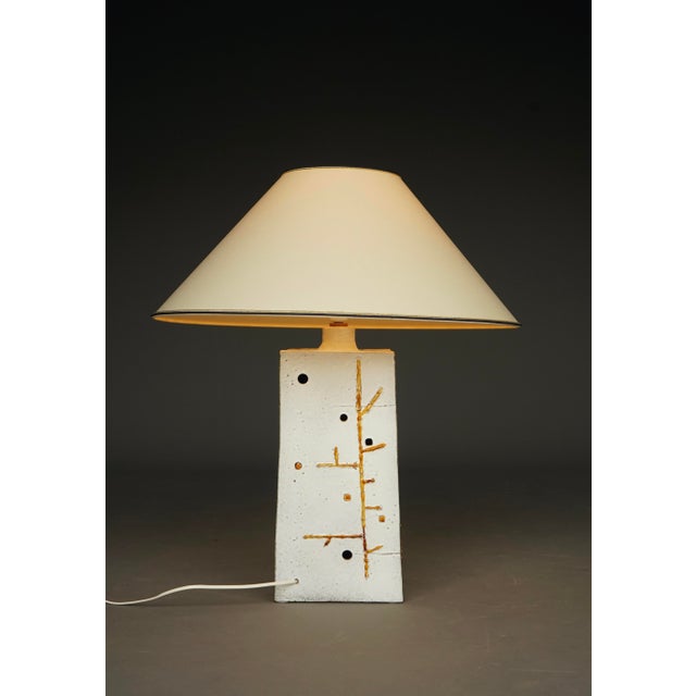 A stylish table lamp with abstract designs to the sides. The base measures 20 x 20 x 49cm high. The total height with the...