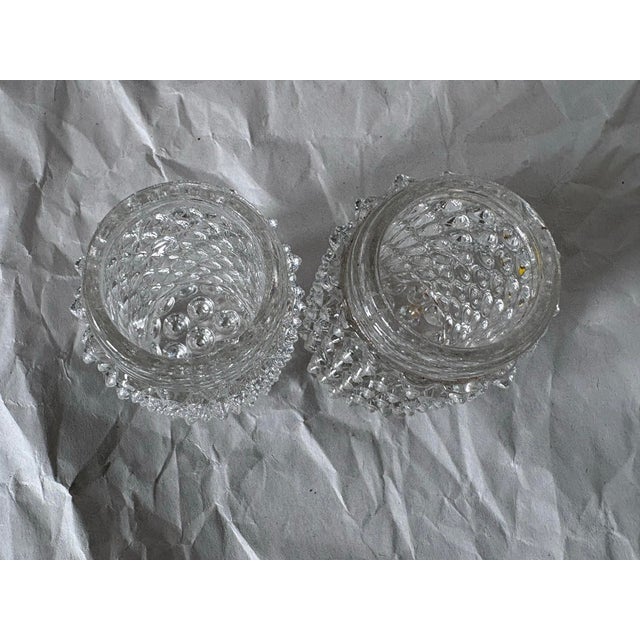 Add a touch of timeless mid-century elegance to your dining room or kitchen collection with this beautiful pair of clear...