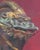 This artwork depicts a striking representation of a basilisk, captured with a focus on its intricate features and ominous...