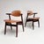 This typical vintage cowhorn chair is recognizable by its armrests shaped like a cowhorn. This distinctive wooden chair is...