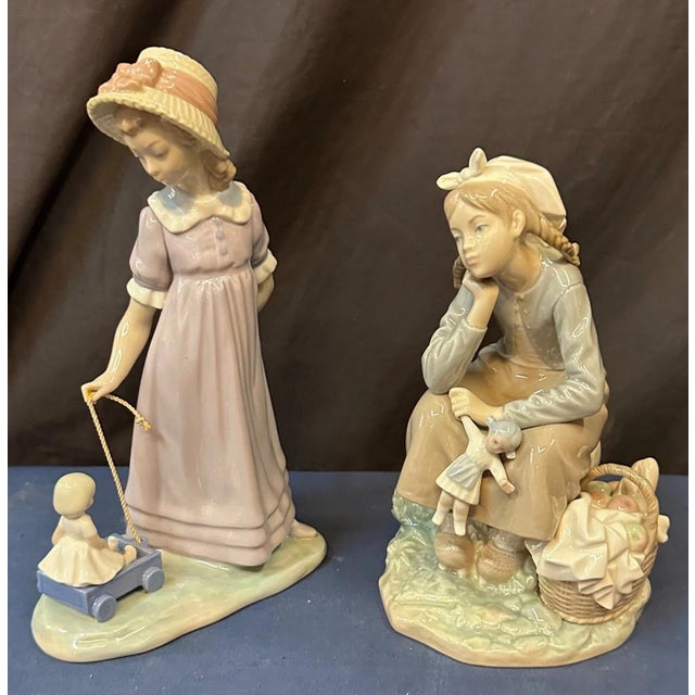 This duo of Lladro porcelains feature two exceptionally rendered & painted figures of children. Both are in very good...