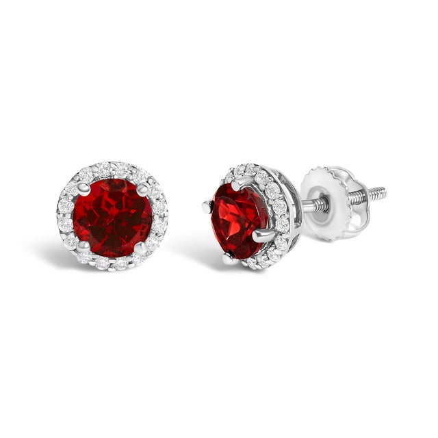 Immerse yourself in the allure of these exquisite 10K white gold stud earrings, each centered with a captivating 5mm...