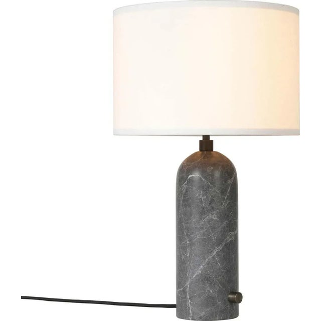 Gray marble 'Gravity' table lamp by Space Copenhagen for Gubi. Executed in gray marble with a white textile (or canvas)...