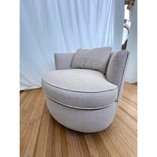 Kravet Provo swivel chair featuring a sculptural circular silhouette with a 360-degree swivel base. Designed for both...