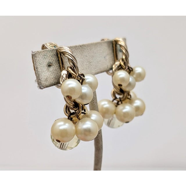 Early 1960s goldotne slightly yellow faux-pearls with single faceted disco ball-like faux-citrine drop clip back earrings....