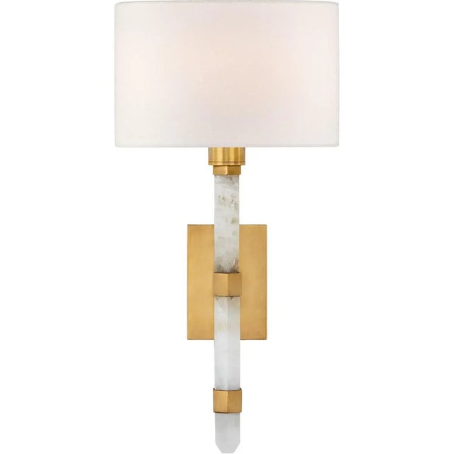 Adaline Small Tail Sconce in Antique-Burnished Brass and Quartz with Linen Shade Designer: Suzanne Kasler Height: 15"...