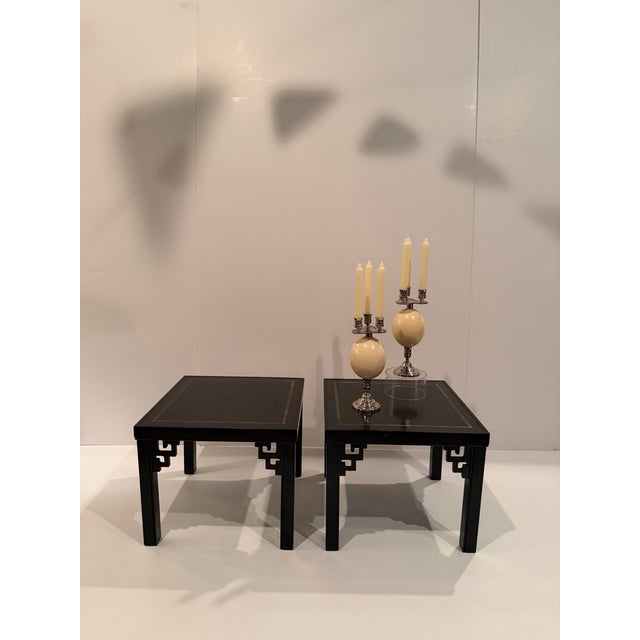 Chic pair of square black tooled leather end tables having gold embossing and fret work with Asian flair. Look great...
