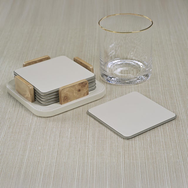 Combining natural textures with refined craftsmanship, this set of six square leather coasters offers a stylish and...