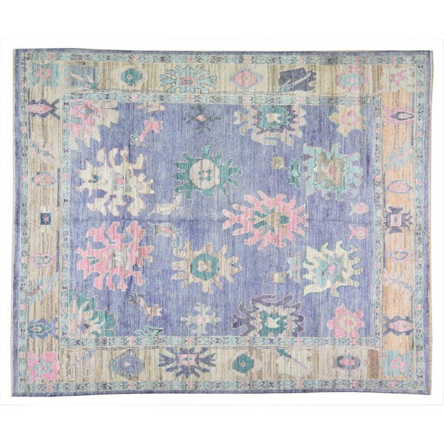 Turkish Oushak Hand-knotted with care using traditional rug-making techniques, this wool rug blends timeless craftsmanship...