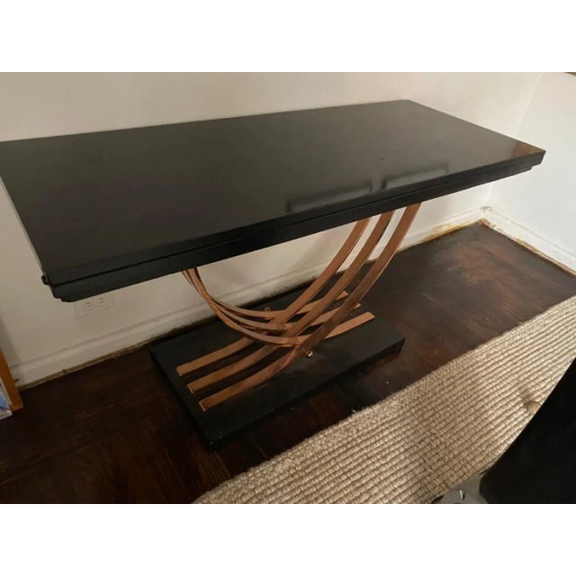 Modernist Art Deco Black Lacquered Wood Console Table With Six Interlocking Flat Copper Bands With Ball Accents That Opens...