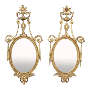 Unique Husband and Wife Pair of Gilded Carved Louis XVI Style Mirrors