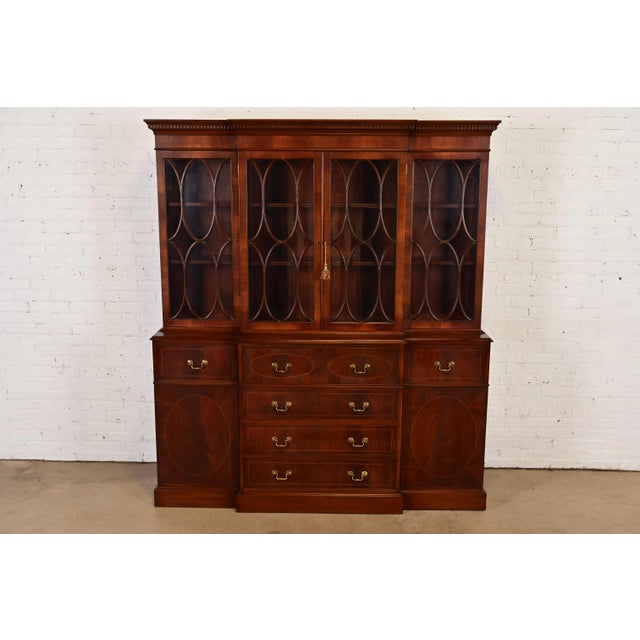 A gorgeous Georgian or Chippendale style dining cabinet or breakfront bookcase with drop front secretary desk In the...