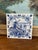 Charming hand-painted Delft blue ceramic tile by Schoonhoven Keramiek of Holland, featuring classic Dutch pastoral scene...