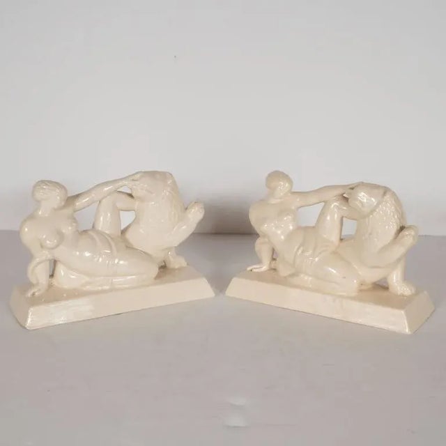 This lovely pair of bookmarks, depicting a nude female figure petting the head of a lion, is rendered in a style...