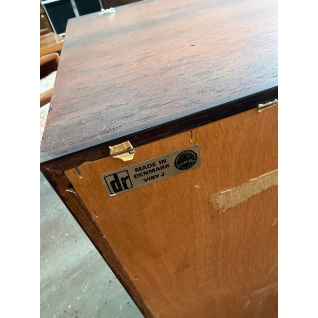 Crafted in Denmark by Dammand & Rasmussen, this elegant rosewood sideboard exemplifies the refined simplicity of...