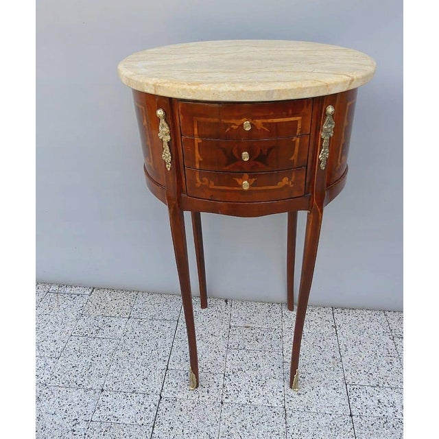 Bring timeless elegance into your home with this exquisite French Louis XVI round side table, masterfully handcrafted from...
