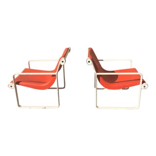 Knoll Iconic Orange Shell Lounge Chairs - A Pair For Sale