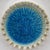 Mid-20th century slip-cast ecru ceramic ashtray filled with bright turquoise crushed glass, by American ceramic artist...