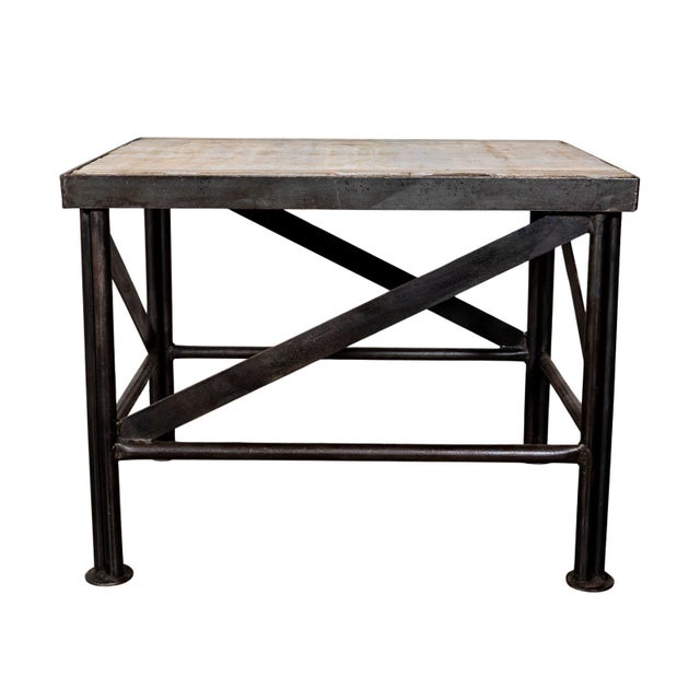 Metal and wood side table. Weathered wood top. Metal base and legs.