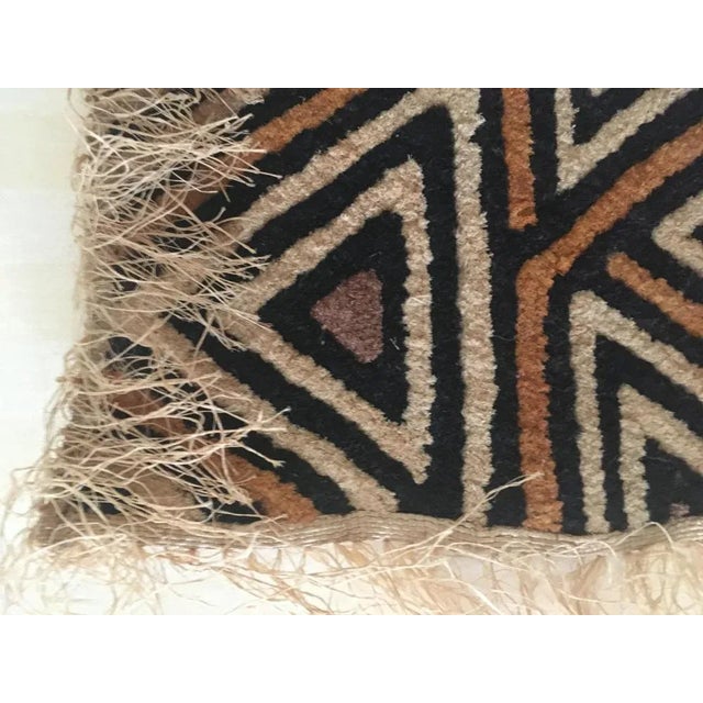 The Kuba cloth (velours du kasai) is a captivating piece of textile art hailing from the Kasai Region in the Democratic...
