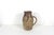 This pitcher is stunning. It has a fabulous deep texture applied to the sides. The colour is earthy. The size is useful...