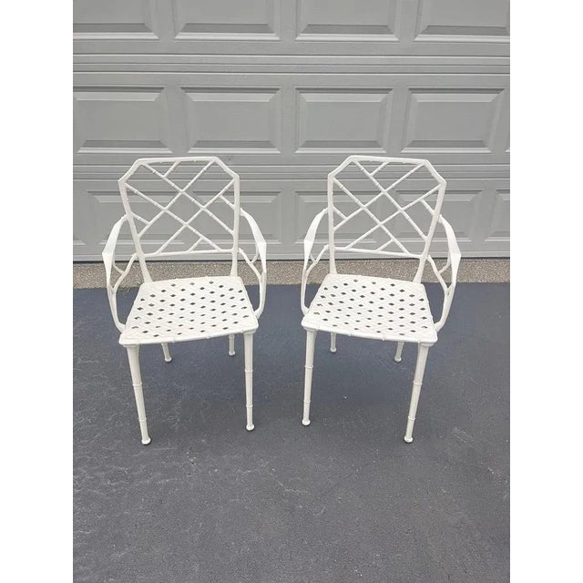 Pair of white faux bamboo “Calcutta” Chairs by Brown Jordan Classic and highly collectible pair of white chinoiserie faux...
