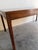Danish Mid-Century Modern coffee table crafted in rich rosewood, showcasing stunning natural grain and timeless...