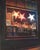 In "Les Etoiles," vibrant pastel colors illuminate a window display, featuring two prominent stars that draw the viewer's...