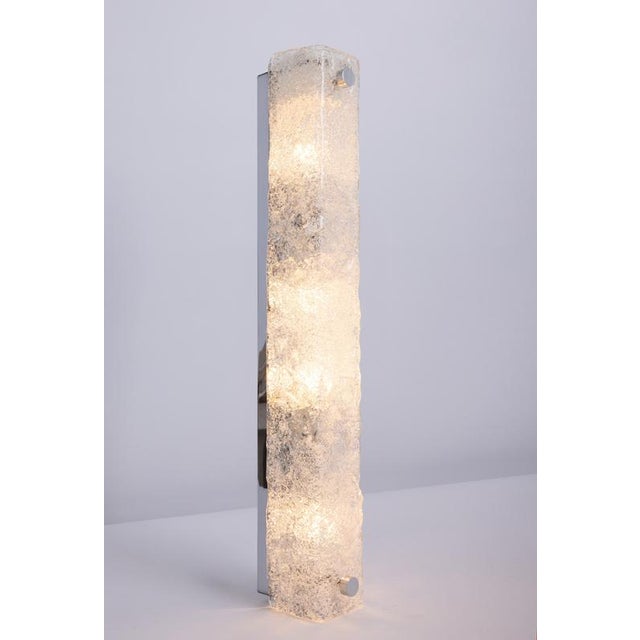 Pair of large handcrafted murano glass on a chromed base sconces by hillebrand, germany, circa 1960s. It consists of a...