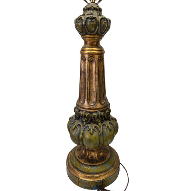 Immense table lamp. No lable, but in a baroque Gilt style.
