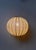 This sculptural pendant light, designed in the 1960s and likely produced in Sweden, is a beautiful example of understated...