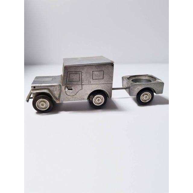 Vintage aluminium willys jeep cigarette case set with lighter, cigarette holder and accompanying ashtray trailer made by...
