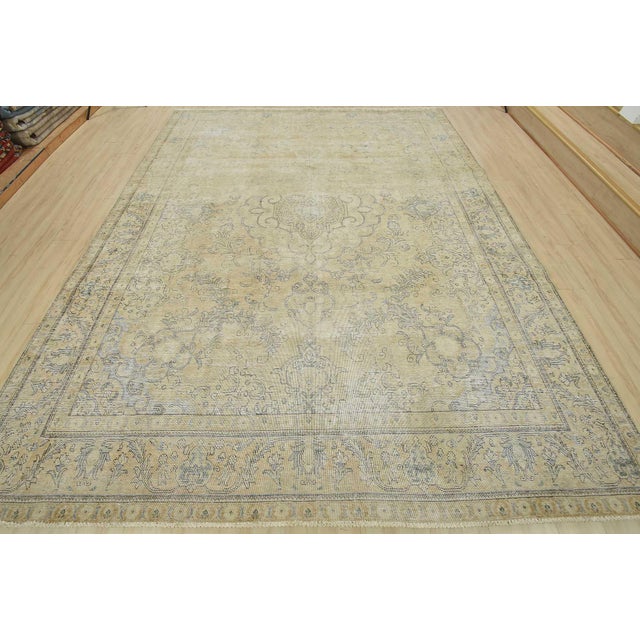 An authentic vintage traditional Tabriz rug hand-knotted with an all-wool pile on a cotton foundation. This oriental rug...