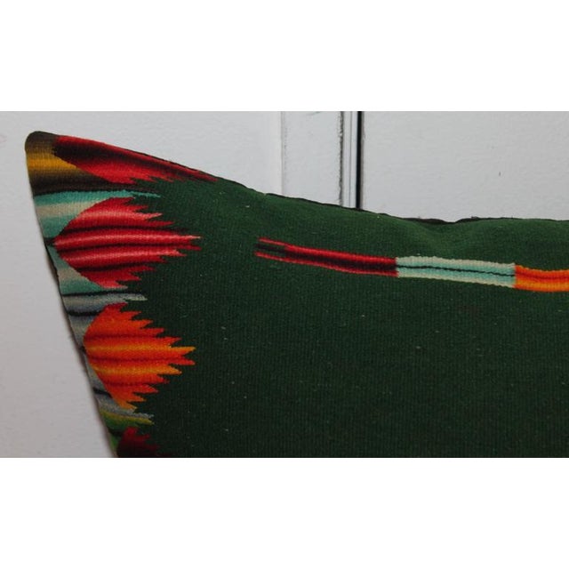 This handwoven Mexican weaving bolster pillow has amazing colors and in fine condition. The backing is in black cotton...
