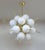 Italian sputnik chandelier with 18 Murano glass globes and brass cylinder spikes mounted on metal frame in light gold...