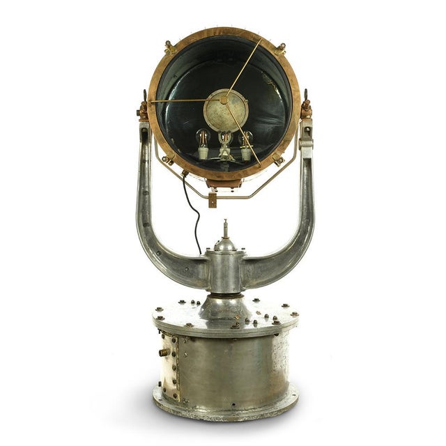 Great boat projector iron and brass. Iron Navy Lighting and brass. Adjustable projector that was used on an old boat. This...