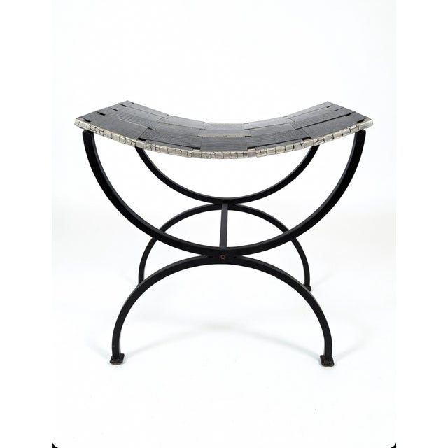This bold, sculptural metal stool is a true statement piece—perfect as a luxe footrest, accent bench, low ottoman, or...