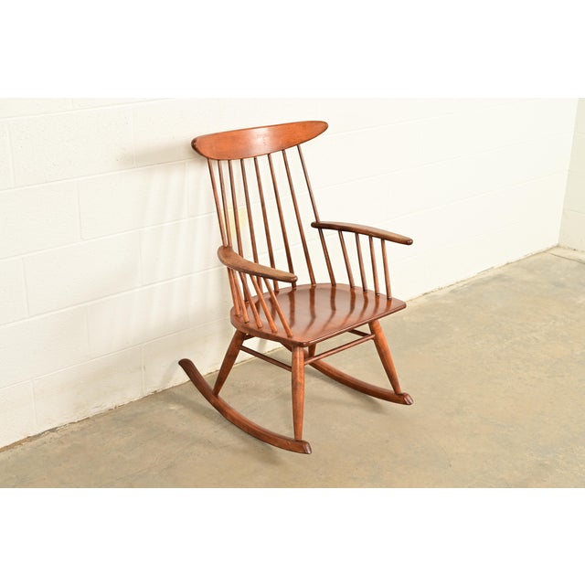 A gorgeous Mid-Century Modern solid birch spindle back rocking chair By Russel Wright for Conant Ball USA, 1950s Measures:...