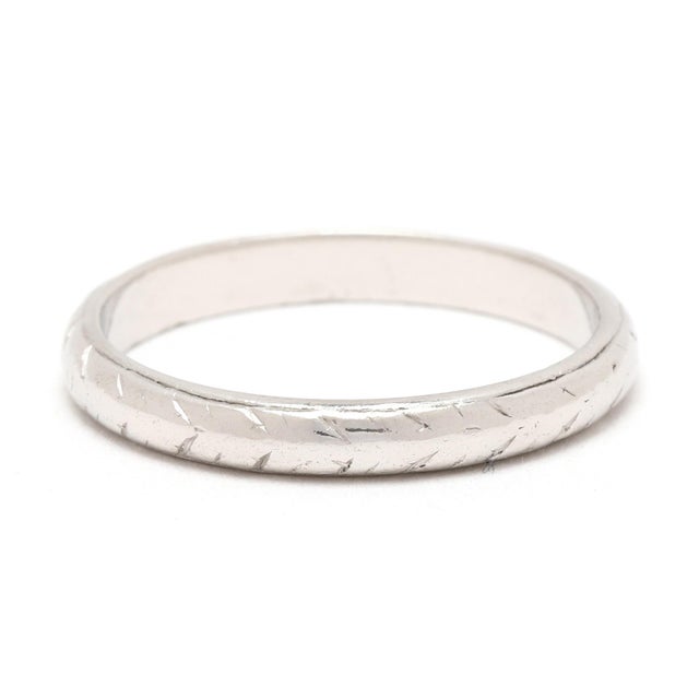 Ring Size 5.75 Rise off of Finger: 1.4 mm Width: 2.6 mm Weight: 2 dwts. / 3.1 grams Stamps: "PLATINUM" SKU: R4184 A Couple...
