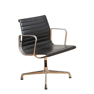 Swivel Chair EA 104 in Chrome-Plated Aluminum and Black Leather Upholstery by Ray and Charles Eames for Vitra, 1958 For Sale
