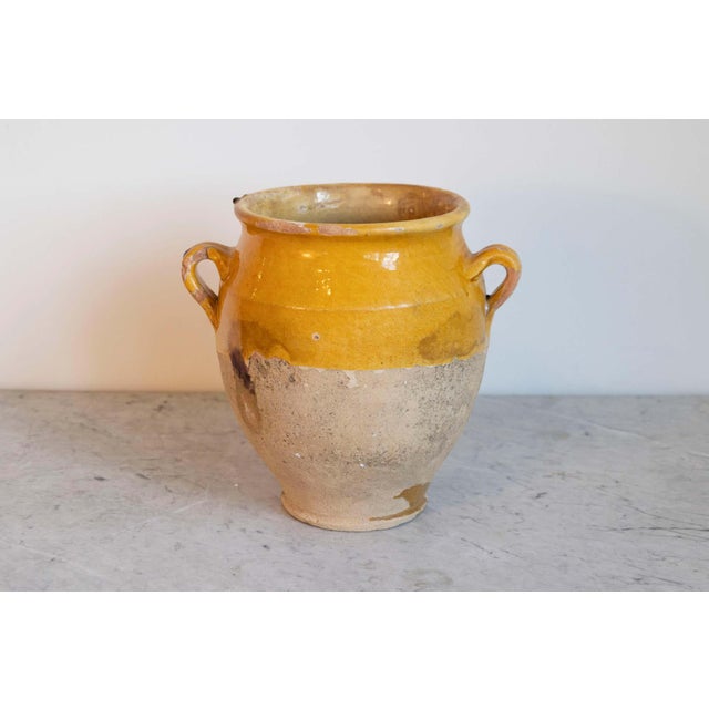 This 19th-century Spanish pottery jar is a beautiful example of rustic Mediterranean craftsmanship. Handcrafted from...