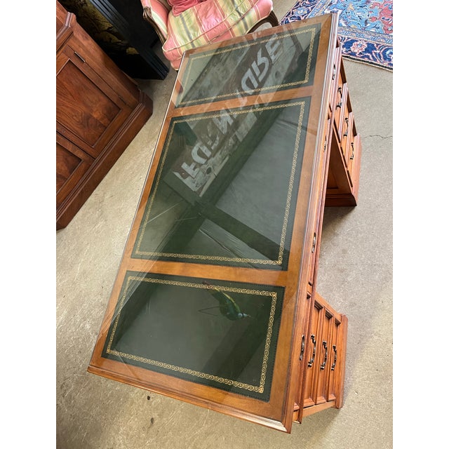 Beautiful pine executive desk by Sligh-Lowry. Features solid wood construction, tooled leather top with custom cut glass,...